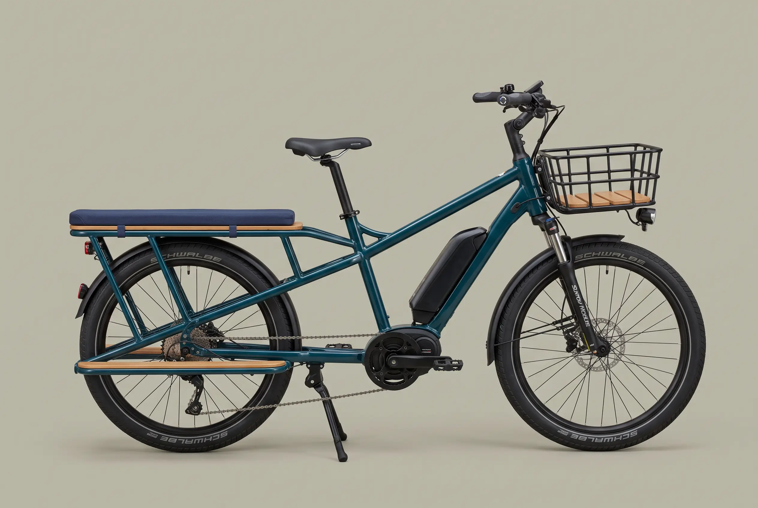 Petrol teal electric longtail cargo bike with an oak deck, bench pad and front basket