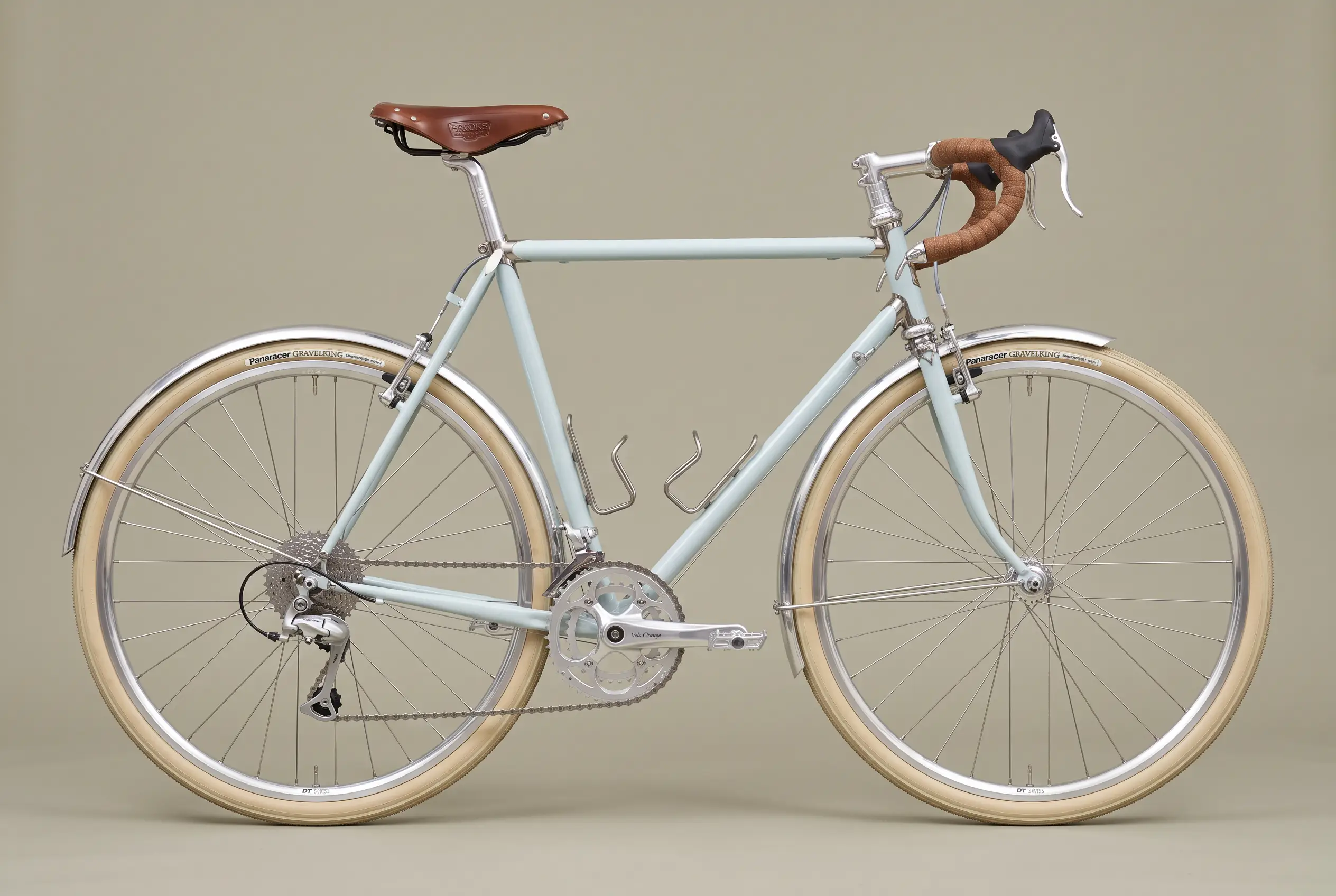 Chalk blue lugged steel all-road bike with polished silver lugs and cork bar tape