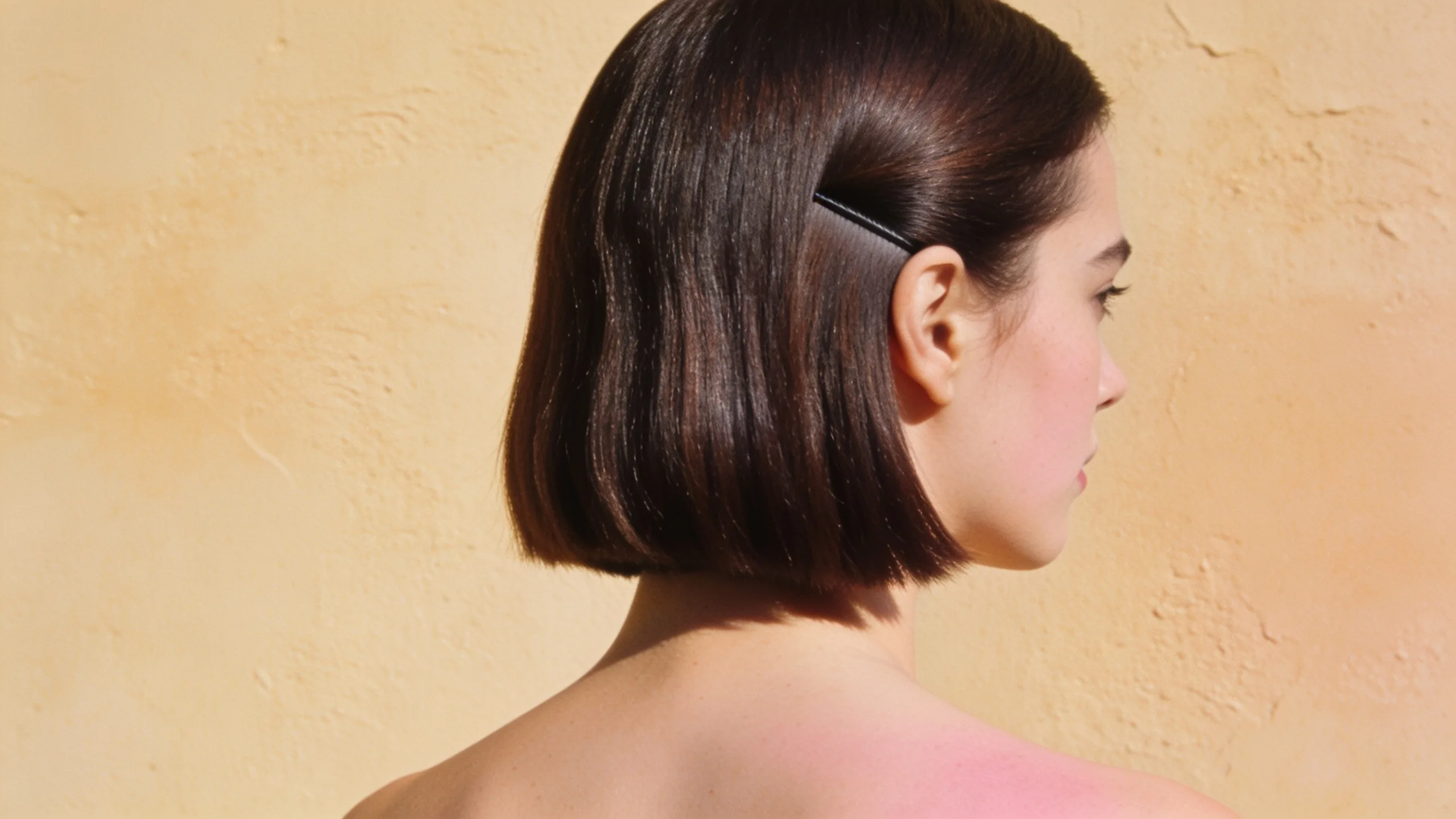 Blunt chin-length bob in glossy brunette